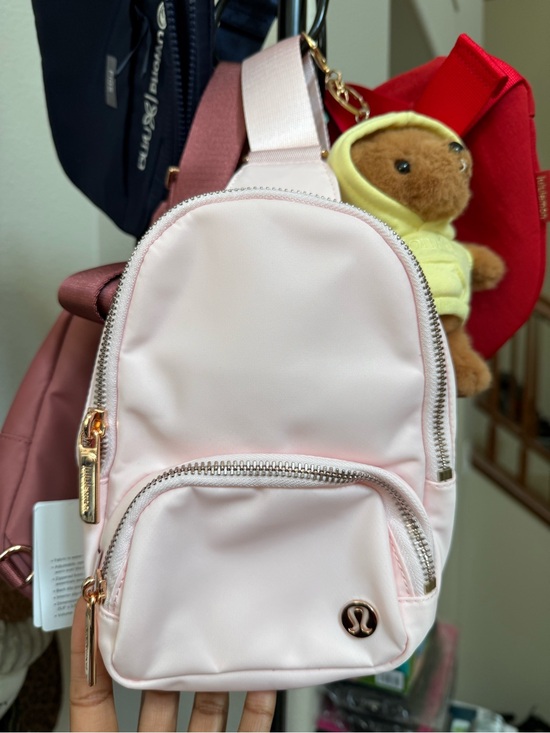 lululemon athletica Handbags - lululemon athletica Light Pink Mini Sling Backpack with Rose Gold Hardware